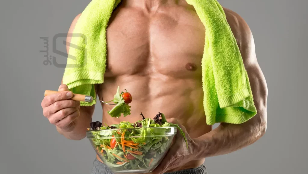 یک ورزشکار که در حال خوردن سبزیجات است